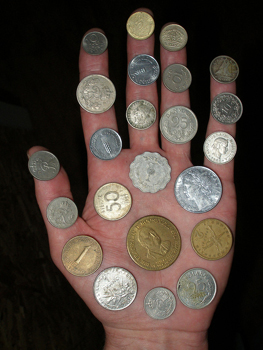 Featured is a photo of a "handful" of coins from around the world.